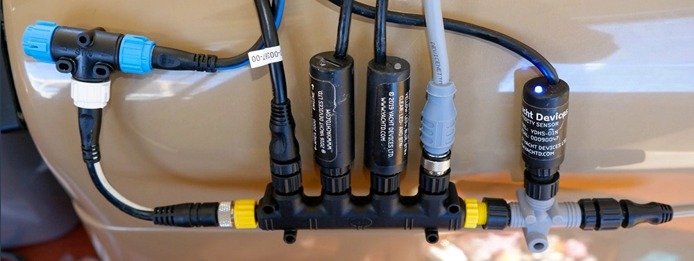 Side‑by‑side photos of Micro‑C vs SeaTalkNG connectors plus an adapter lead diagram